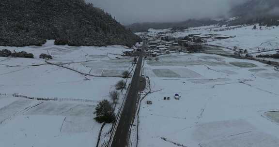 西藏林芝地区鲁朗小镇雪景高空航拍