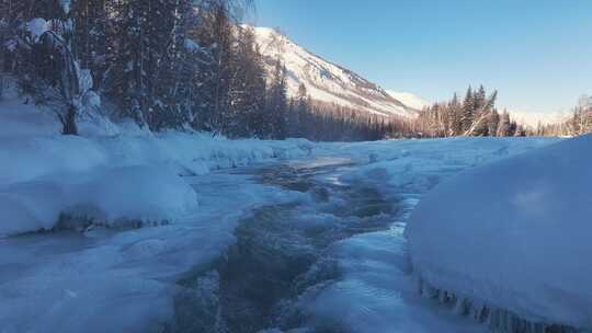 阿勒泰禾木冬季冰雪河流瀑布航拍风景