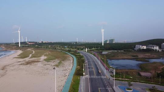 航拍山东威海海岸线公路风车唯美风光