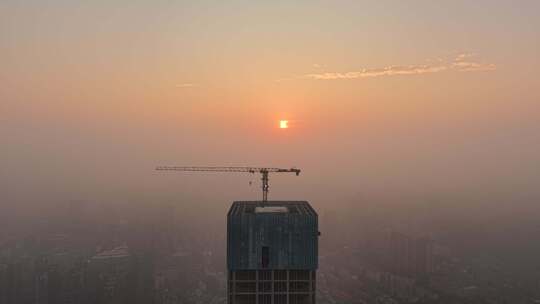 城市高楼建筑吊塔日出航拍