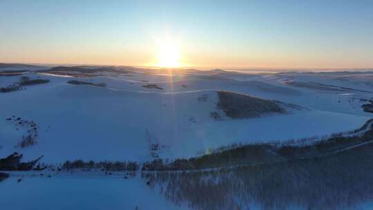 大兴安岭自然风光丘陵山区冬季雪景落日余晖