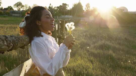 一个吹蒲公英种子的女人