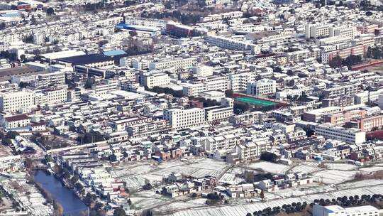 航拍乡镇雪景学校建筑田地大桥别墅河流房屋