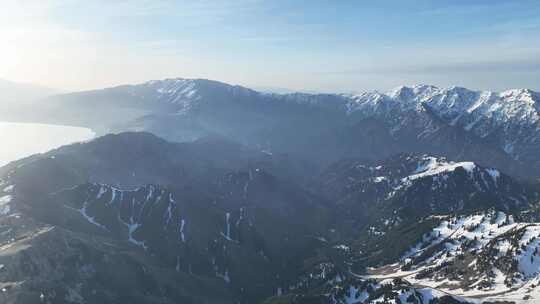 航拍新疆伊犁雪山上的云杉树