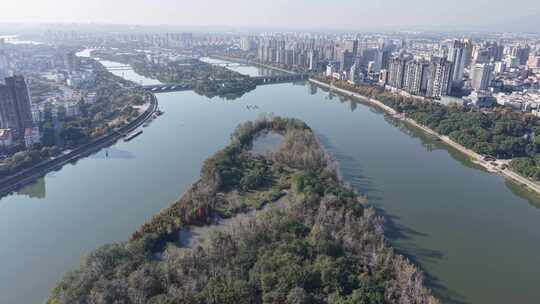 城市河流两岸林立的高楼鸟瞰金华燕尾洲公园