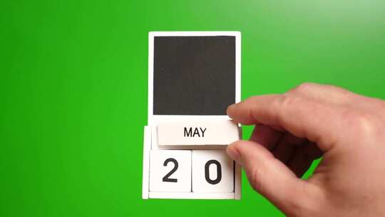 05.绿色背景上日期为5月20日的日历。视频素材模板下载