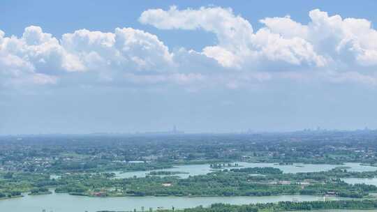 航拍蓝天白云云海平原乡镇延时空景