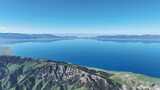 航拍中国新疆被群山环绕的赛里木湖晴天风光高清在线视频素材下载