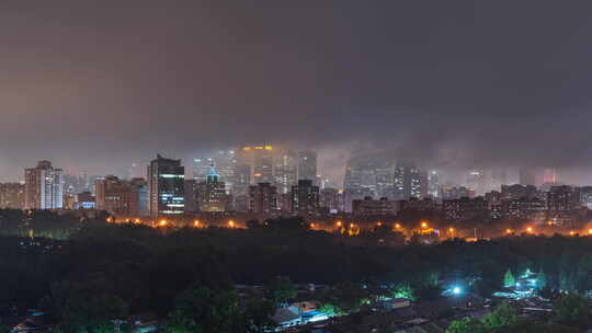 北京夜晚城市建筑群雨天建筑云海穿云延时