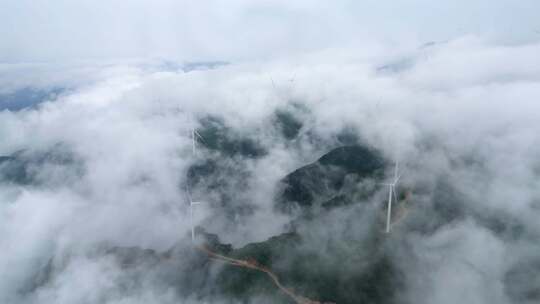 航拍穿云海清洁能源风力发电风车
