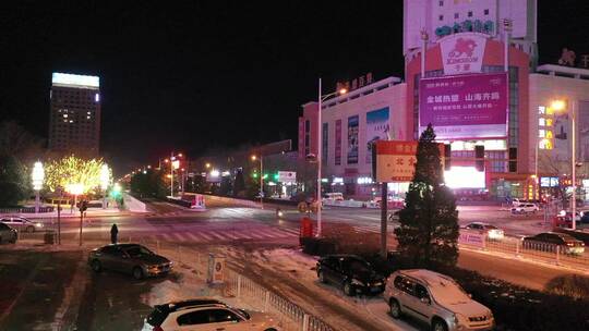 雪后城市霓虹夜景航拍