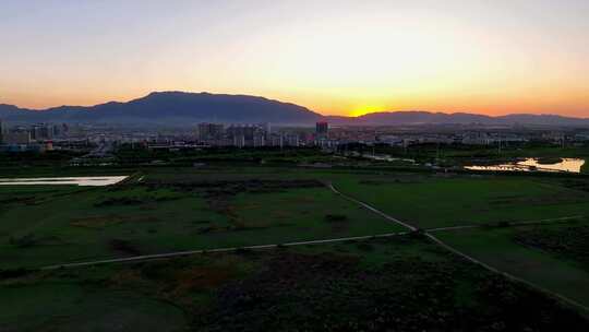 航拍夕阳下宁夏石嘴山惠农区城市风光