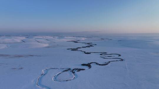 航拍内蒙古雪原蜿蜒冰河暮色