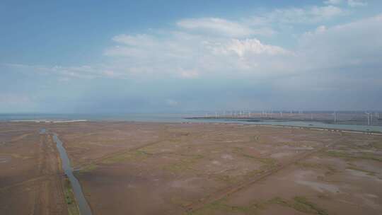 大海海边沙滩风车自然风光蓝天白云航拍