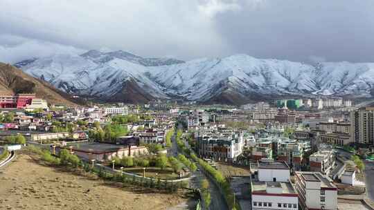 航拍拉萨慈觉林雪山城市高原气候视频素材模板下载