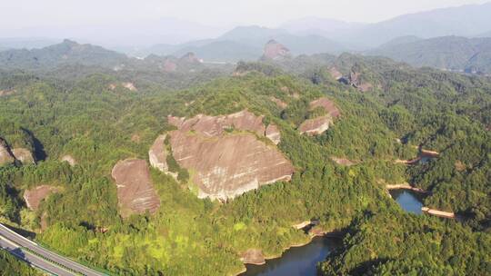 航拍铜鼓县丹霞地貌及杭长高速公路