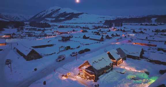 航拍新疆阿勒泰禾木村冬夜雪景