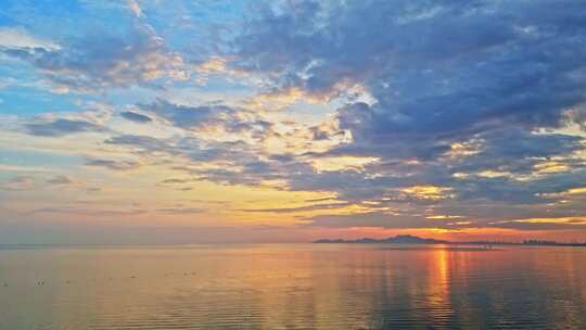 海边沙滩海上日出海面日出朝霞暖调航拍