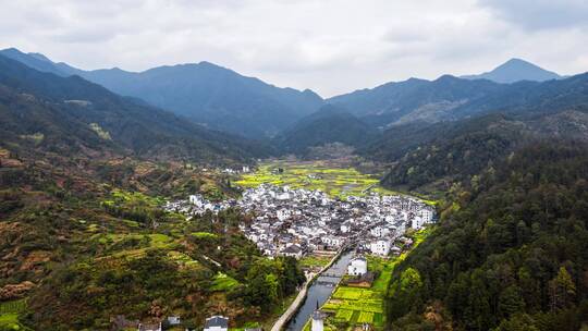 航拍春天婺源理坑油菜花徽派建筑群延时