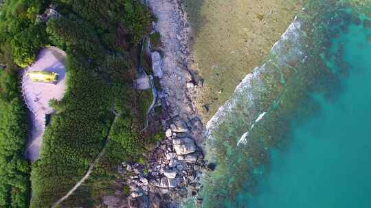 航拍海南三亚西岛海洋文化旅游区海浪礁石
