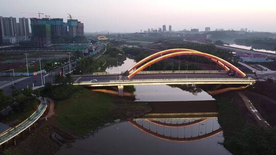 航拍湖南衡阳陆家新区城市夜景人行观光桥