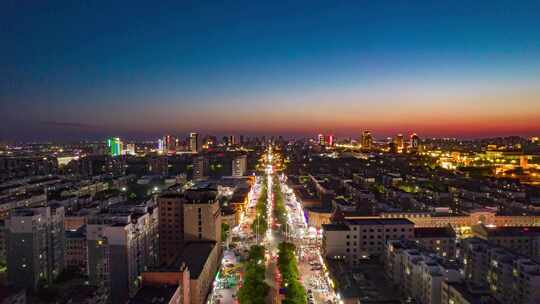 山东东营城市夜景交通夜宵一条街航拍