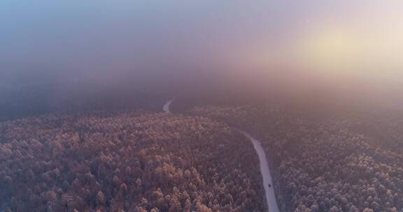 航拍冬季山林雾凇晨雾朝阳