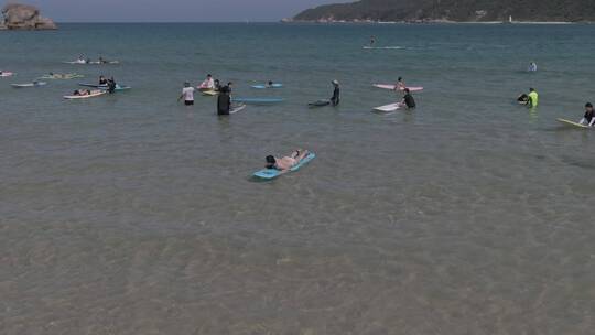 航拍海南三亚后海海滩冲浪游玩