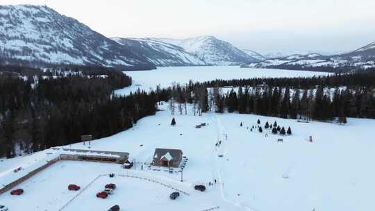 航拍新疆冬季喀纳斯湖雪景雪山森林冰河寒冷