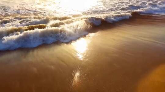 沙滩海浪日落景象