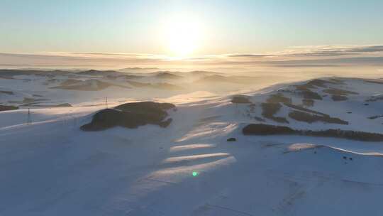 航拍雪域雪原夕阳