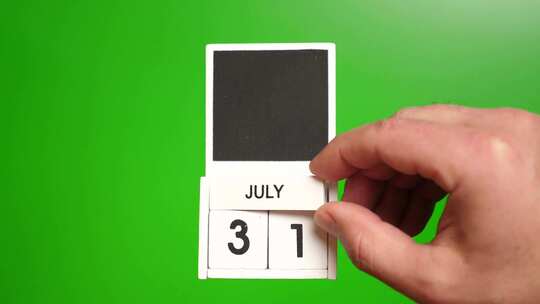 07.绿色背景上日期为7月31日的日历。视频素材模板下载