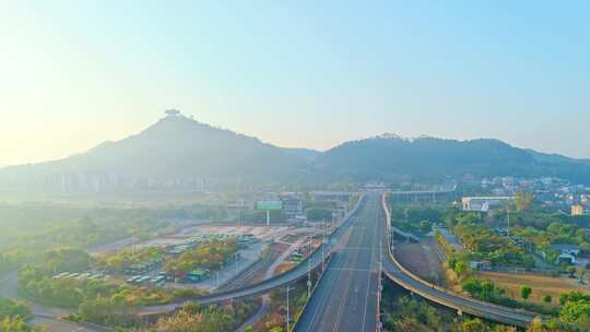 航拍冬季清晨阳光下广东梅州神光山前的公路