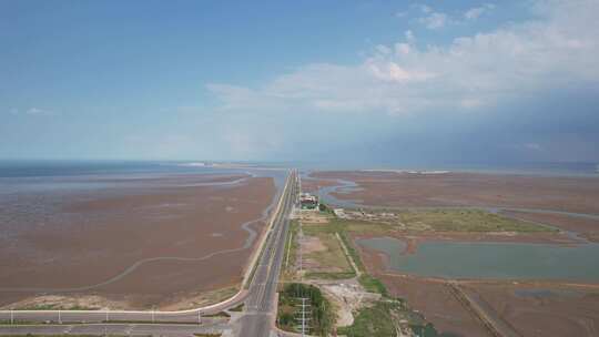 大海海边沙滩风力发电风车航拍