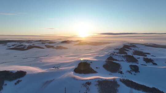 航拍雪域雪原夕阳