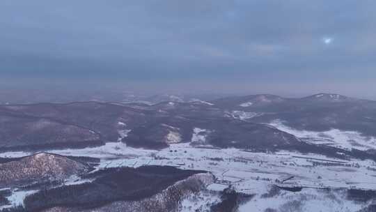 航拍寒冬山区山林雪景暮色