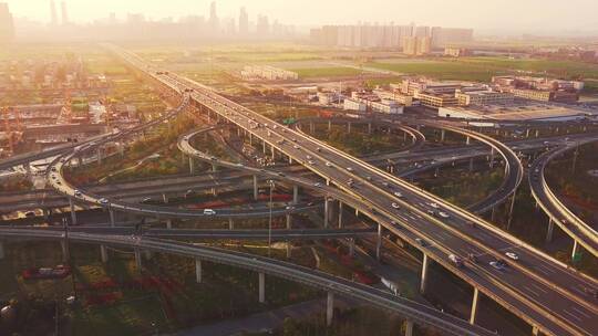 航拍夕阳下杭州萧山机场城市大道高架车流视频素材模板下载