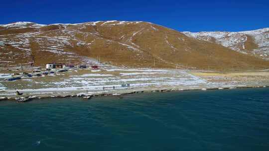 航拍西藏冬季羊卓雍措羊湖纳木错湖水与雪山视频素材模板下载