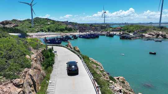 汽车行驶在海边公路航拍风景旅拍旅行自驾游