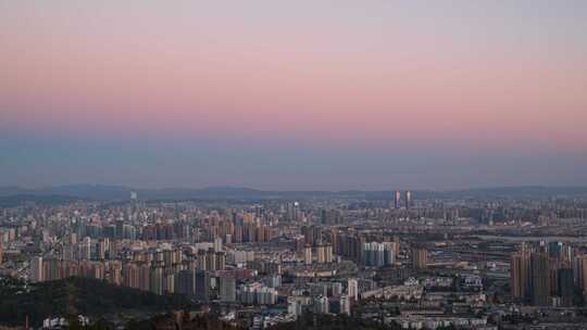 云南省昆明市高视角城市风光日转夜延时摄影
