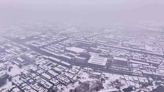 航拍乡镇雪景学校建筑田地大桥别墅河流房屋