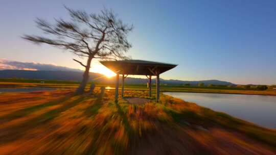 4k航拍fpv穿越机日落夕阳田野凉亭