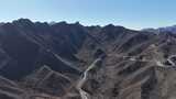 航拍山间蜿蜒公路高清在线视频素材下载