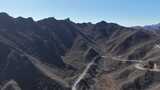 航拍山间蜿蜒公路高清在线视频素材下载