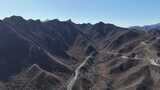 航拍山间蜿蜒公路高清在线视频素材下载
