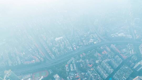 雨雾天气航拍广州城市密集建筑与道路车流