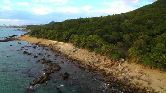 航拍海南三亚大小洞天灯塔椰林海浪礁石沙滩视频素材模板下载