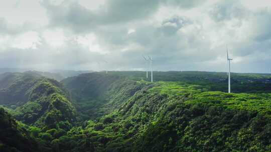 航拍绿色丛林风车风景