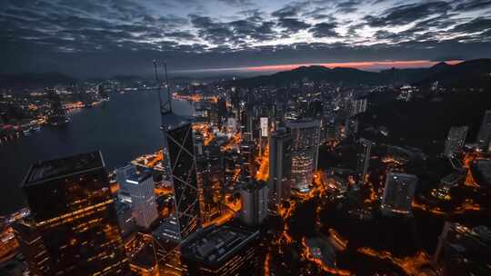 航拍香港高楼灯光和维多利亚湾晚霞