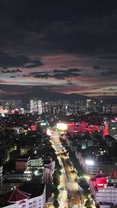 竖屏航拍城市晚霞夜景广西玉林夜景